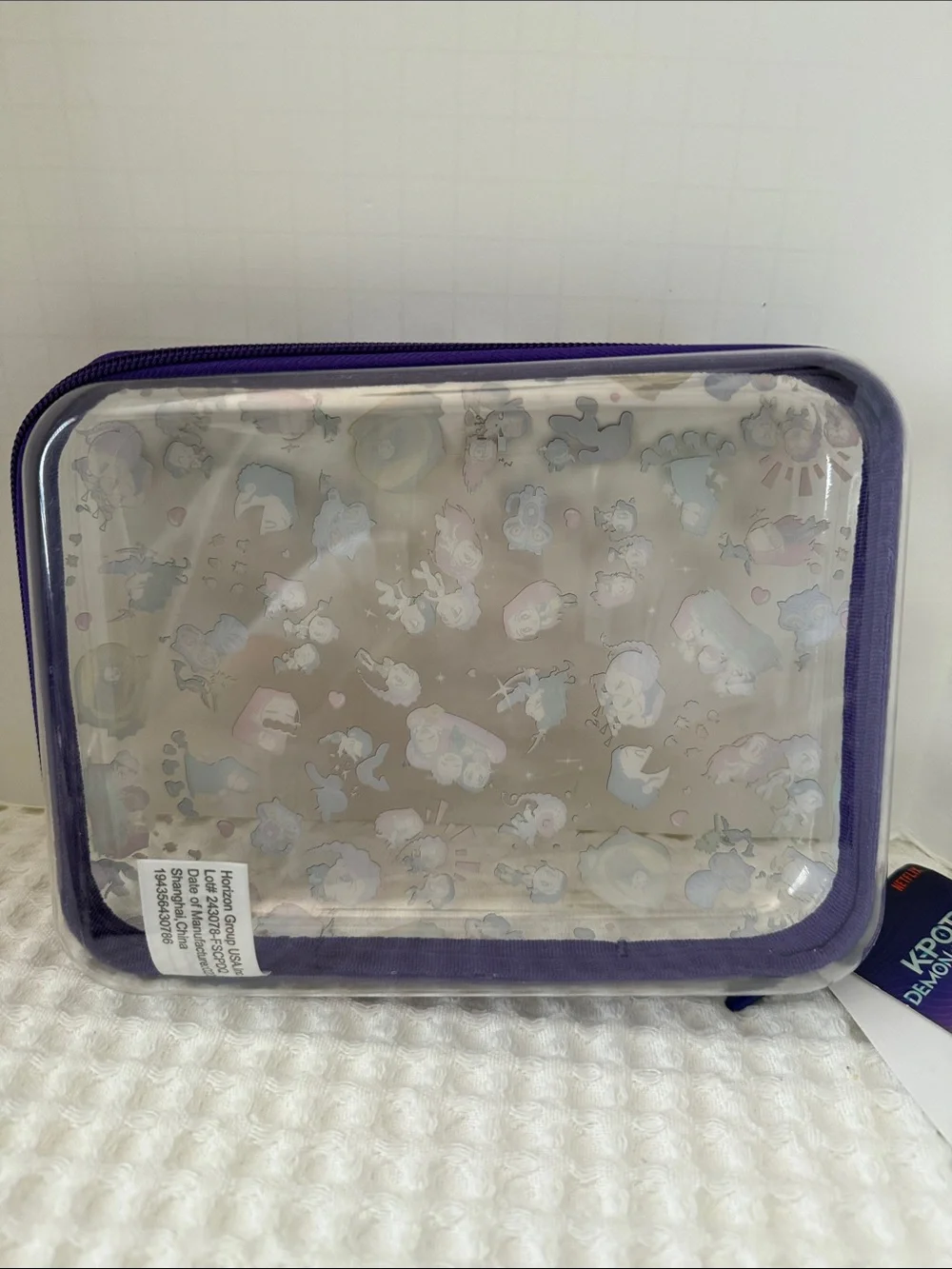Netflix K-POP Demon Hunters Chibi-Style Clear PVC Pencil Case with Purple Trim.